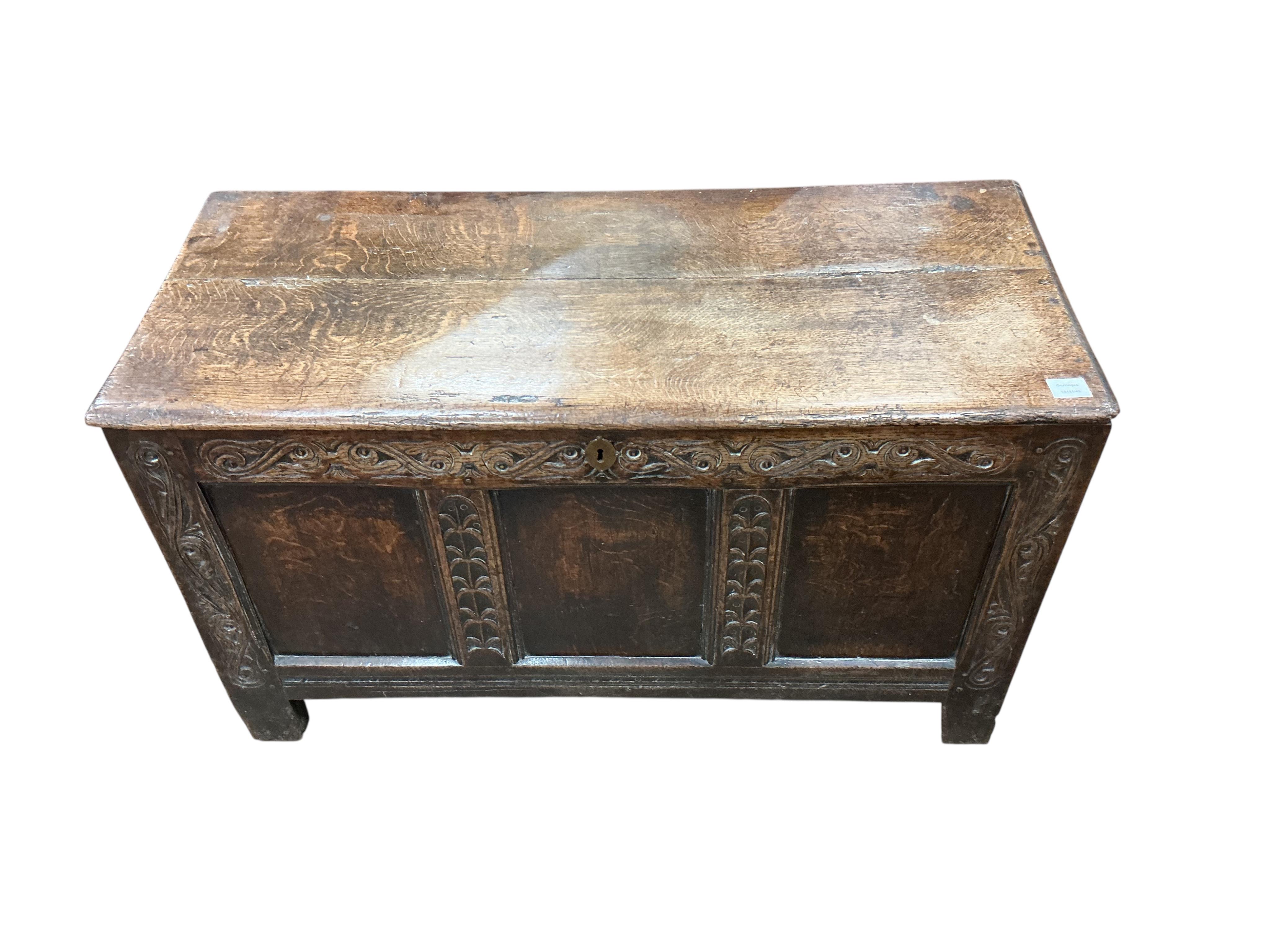 An 18th century panelled oak coffer, width 111cm, depth 48cm, height 65cm